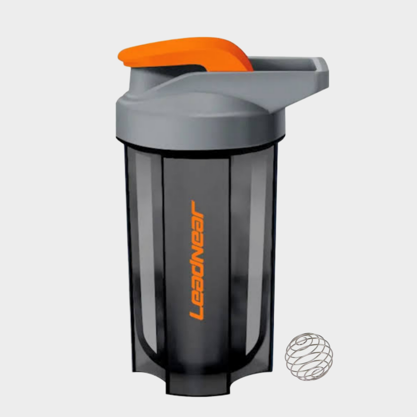 Gray shaker bottle with orange top on a light gray background